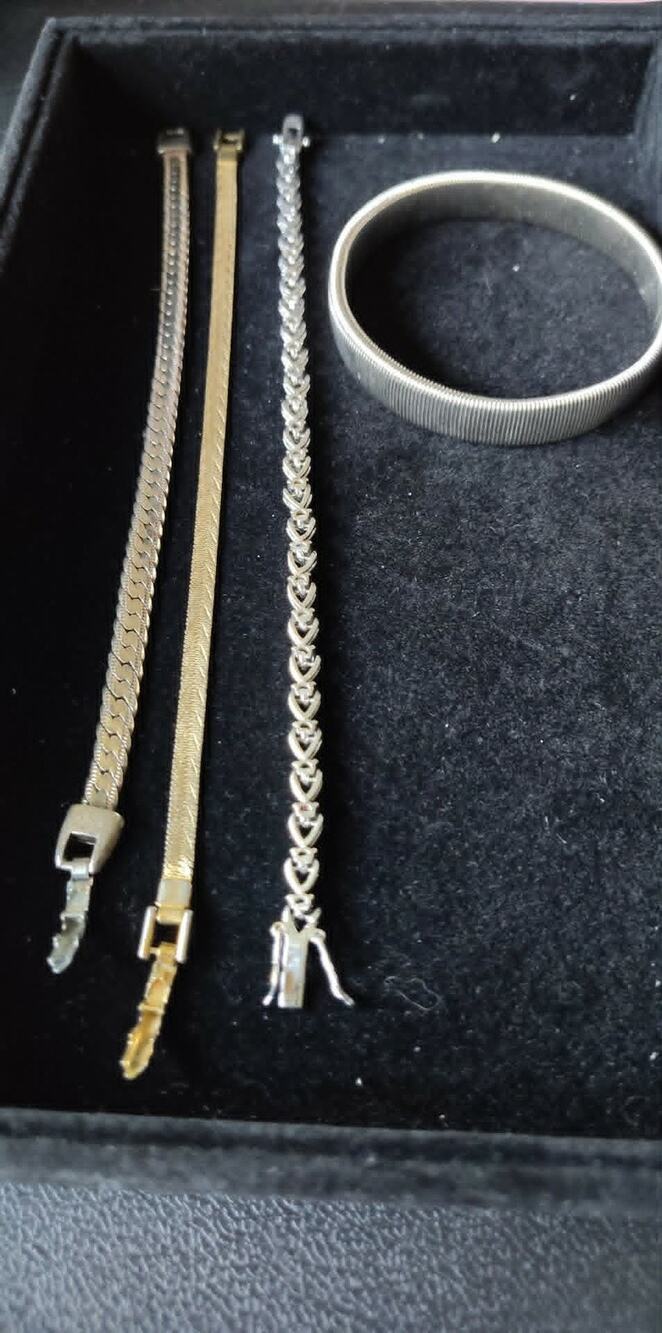 4 gold & silver toned bracelets, one stretch